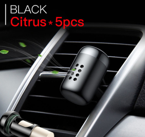 ScentFrame Black Citrus air freshener clipped to car vent