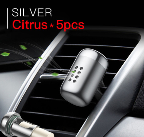 ScentFrame Silver Citrus air freshener clipped to car vent
